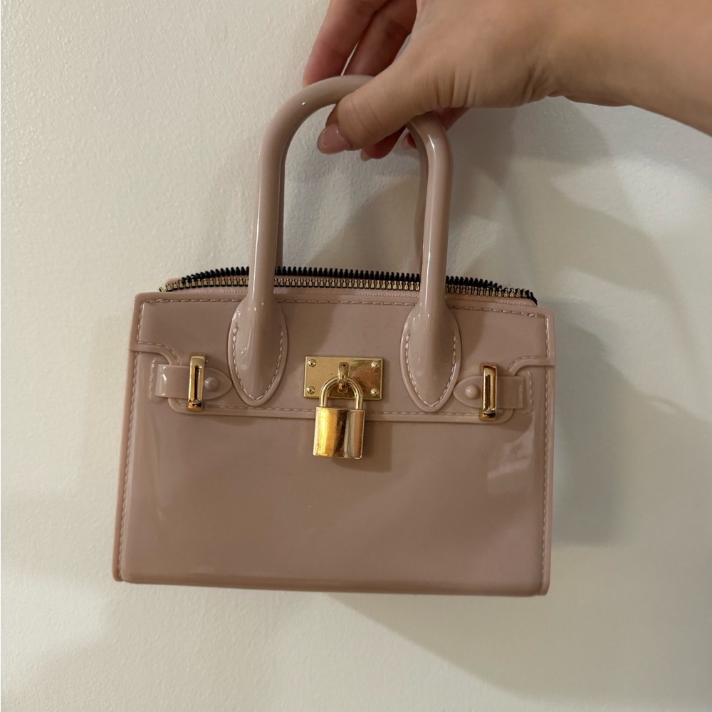 Elegant Tannish Pink Handbag with Gold Accents